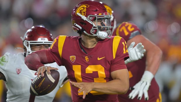 Oct 8, 2022; Los Angeles, California, USA; Pressure from Washington State Cougars linebacker Daiyan Henley (1) forces an incomplete pass by USC Trojans quarterback Caleb Williams (13) in the second half at United Airlines Field at Los Angeles Memorial Coliseum.